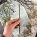 Зелена воскова свічка з корицею, лавровим листом та гвоздикою 20 см